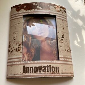 Distressed look picture frame. Made for hanging and fits 4 by 6 pictures